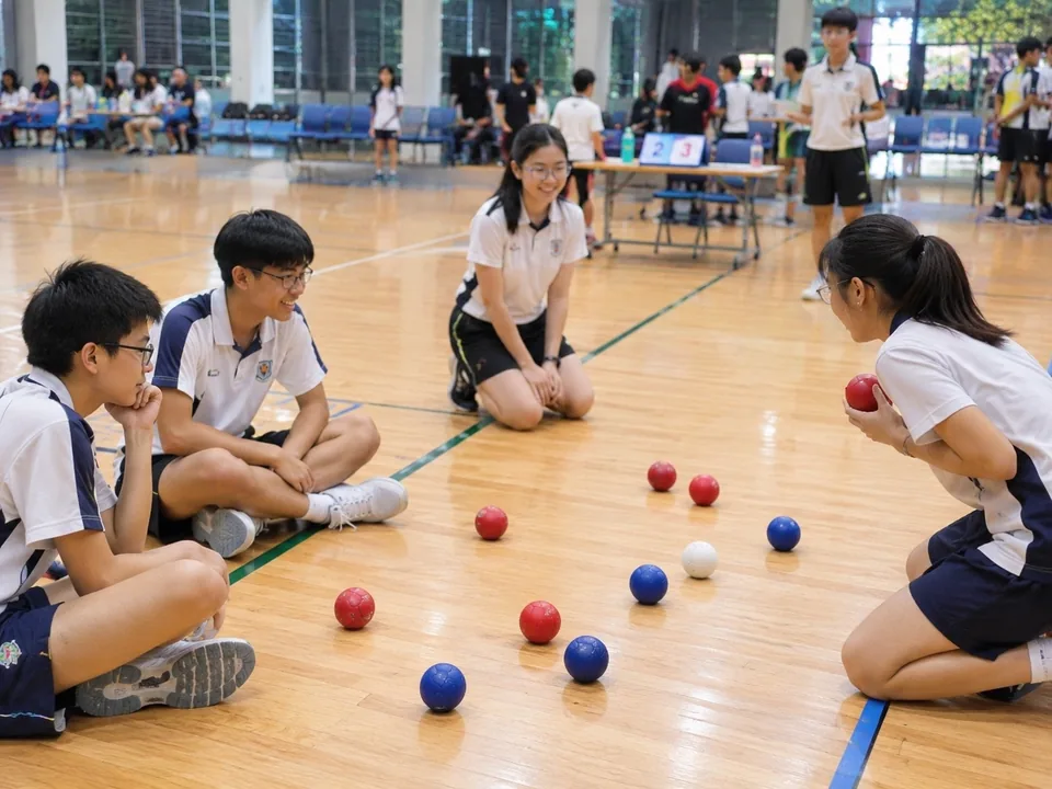 Students playing boccia together in a school hall